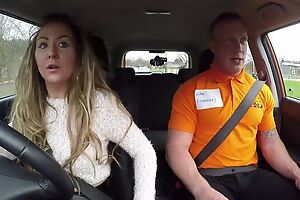 Long-haired MILF blows her car driving instructor
