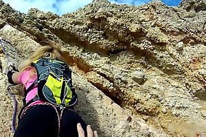 Blonde Alpinist Climbs on a Eternal Rod laze about
